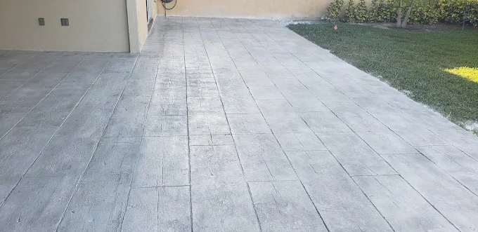 Professional stamped concrete patio installation in Florida by Heritage Contracting Services